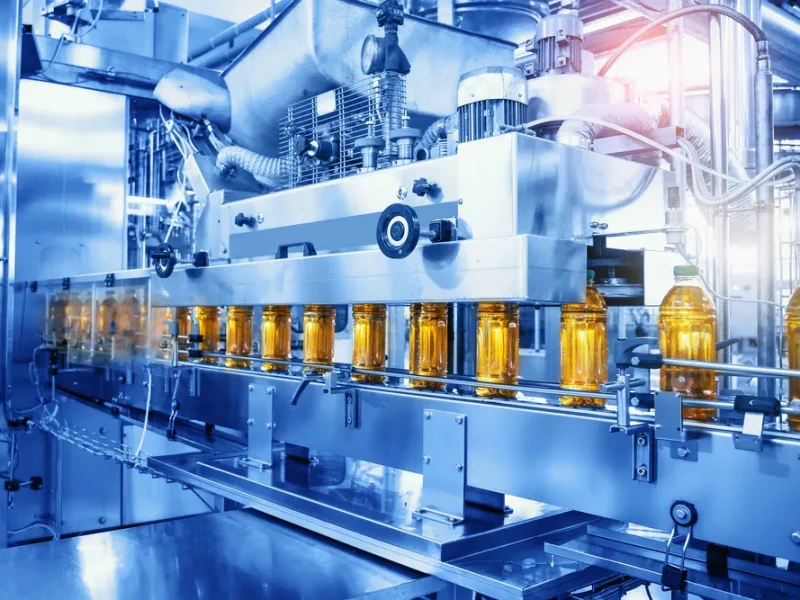 Conveyor belt with juice in bottles